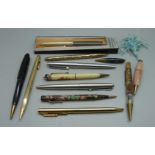 A collection of pens and pencils