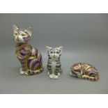 Three Royal Crown Derby paperweights, cats, all with stoppers