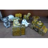 A collection of vintage money boxes including Szeiler, Royal Doulton Bunnykins, etc.