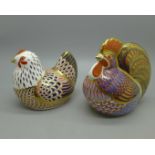 Two Royal Crown Derby paperweights, a hen and a cockerel, both with stoppers