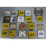 An assortment of car badges, mostly AA & RAC