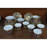 A collection of Royal Crown Derby 1128 pattern teawares, seven cups, four large and six small