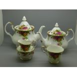 Two Royal Albert Old Country Roses tea pots, a tea cup, cream and sugar,