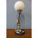 An Art Deco style figural chrome effect table lamp