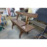 A stained pine platform style bench