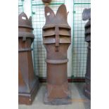 A Victorian terracotta crown glazed chimney pot