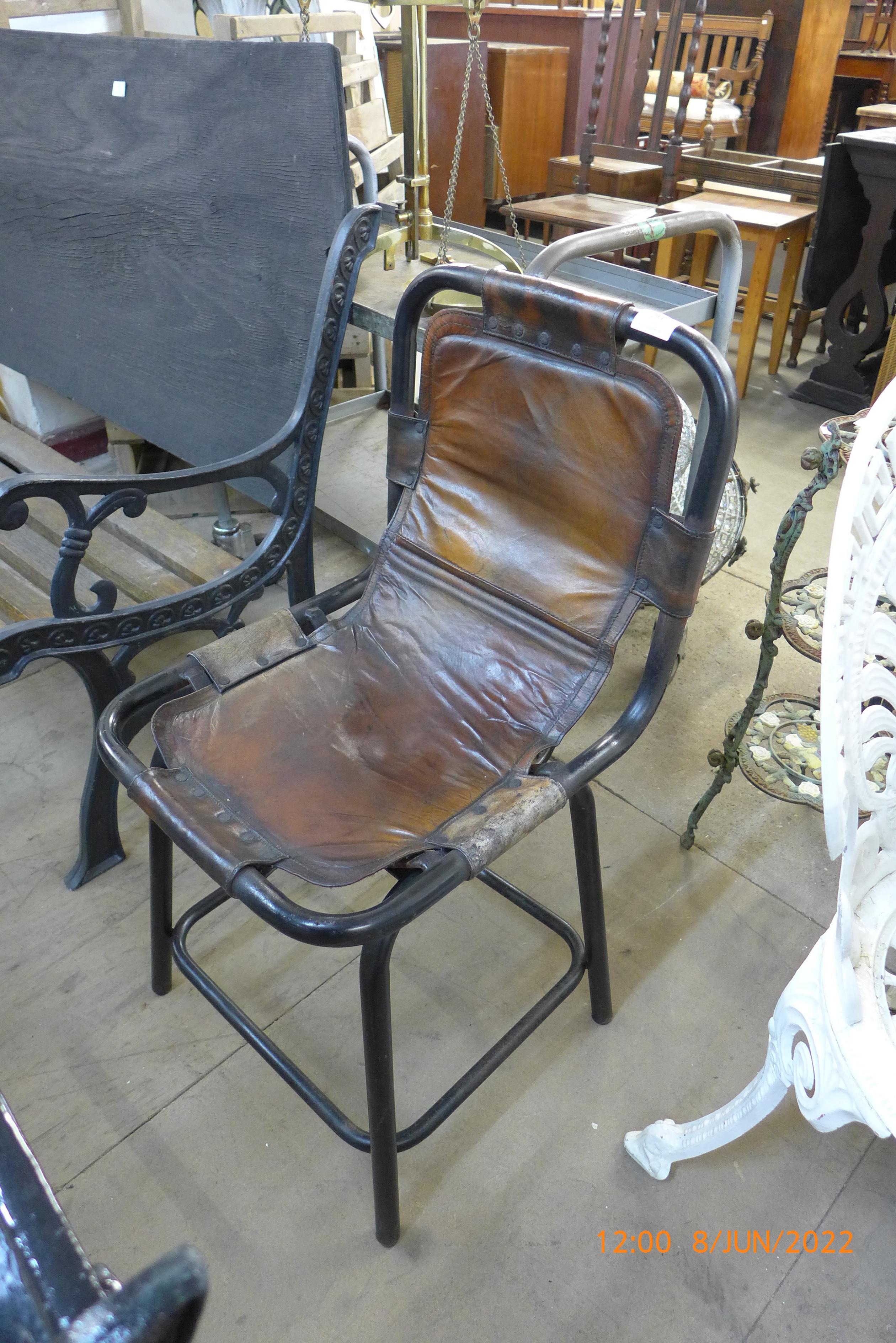 An industrial style steel and leather chair