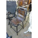 An industrial style steel and leather chair
