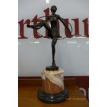 An Art Deco style bronze figure of a hoop girl, on rouge marble socle