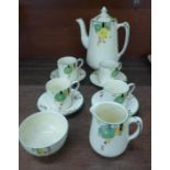 A Homeleigh Ware coffee set, Mayfair, reg. mark 779736, four cups, saucers, cream and sugar, cream