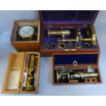 A R&J Beck gilt brass microscope, numbered 8465 with additional eyepieces, two other microscopes and