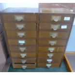 An oak wooden cabinet with sixteen drawers containing watch parts, cabinet 50.5cm x 56cm x 18cm **