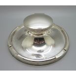 A large silver Capstan inkwell, worn Birmingham hallmark, diameter of base 17.5cm