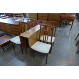 A teak drop-leaf table and four chairs