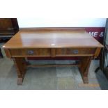 A Victorian mahogany two drawer writing table