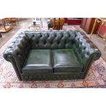 A green leather Chesterfield settee