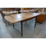 A Danish teak extending dining table