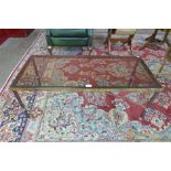 An Italian brass and glass topped rectangular coffee table