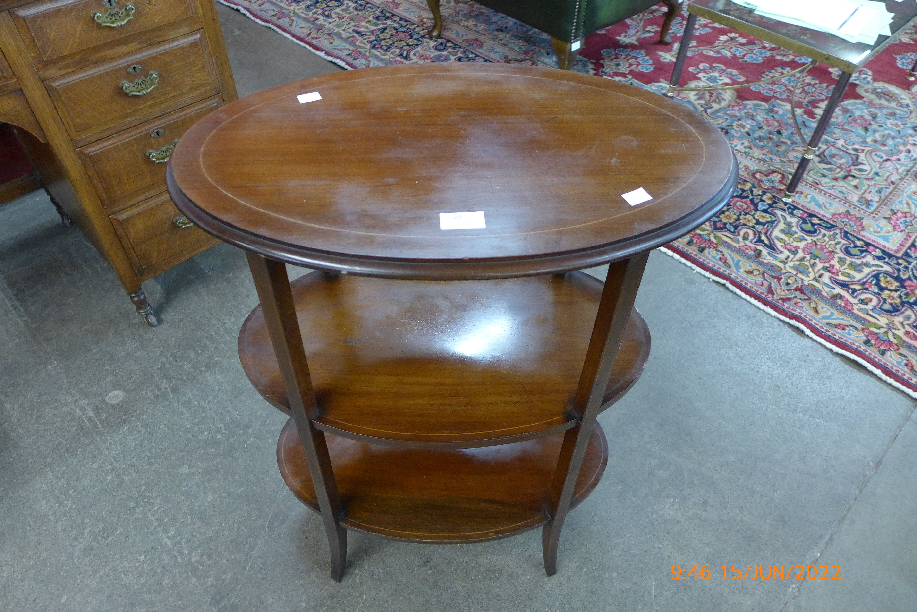 An Edward VII inlaid mahogany oval three tier etagere