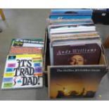 A box of compilation LP records, mainly rock n roll