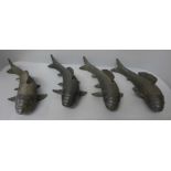 Four bronze models of fish