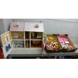 A dolls house and a quantity of furniture and accessories