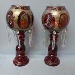A pair of 'ruby' glass lustres, 32.5cm