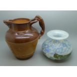 A Doulton Lambeth salt glaze relief hunting jug and an Isle of Wight glass vase