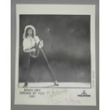 A Queen related autographed Parlophone promotional photograph of Brian May