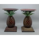 A pair of bronze 'pineapple' candlesticks, 19cm