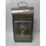 A large late 19th Century carriage lamp with three bevelled glass panels, one side glass cracked