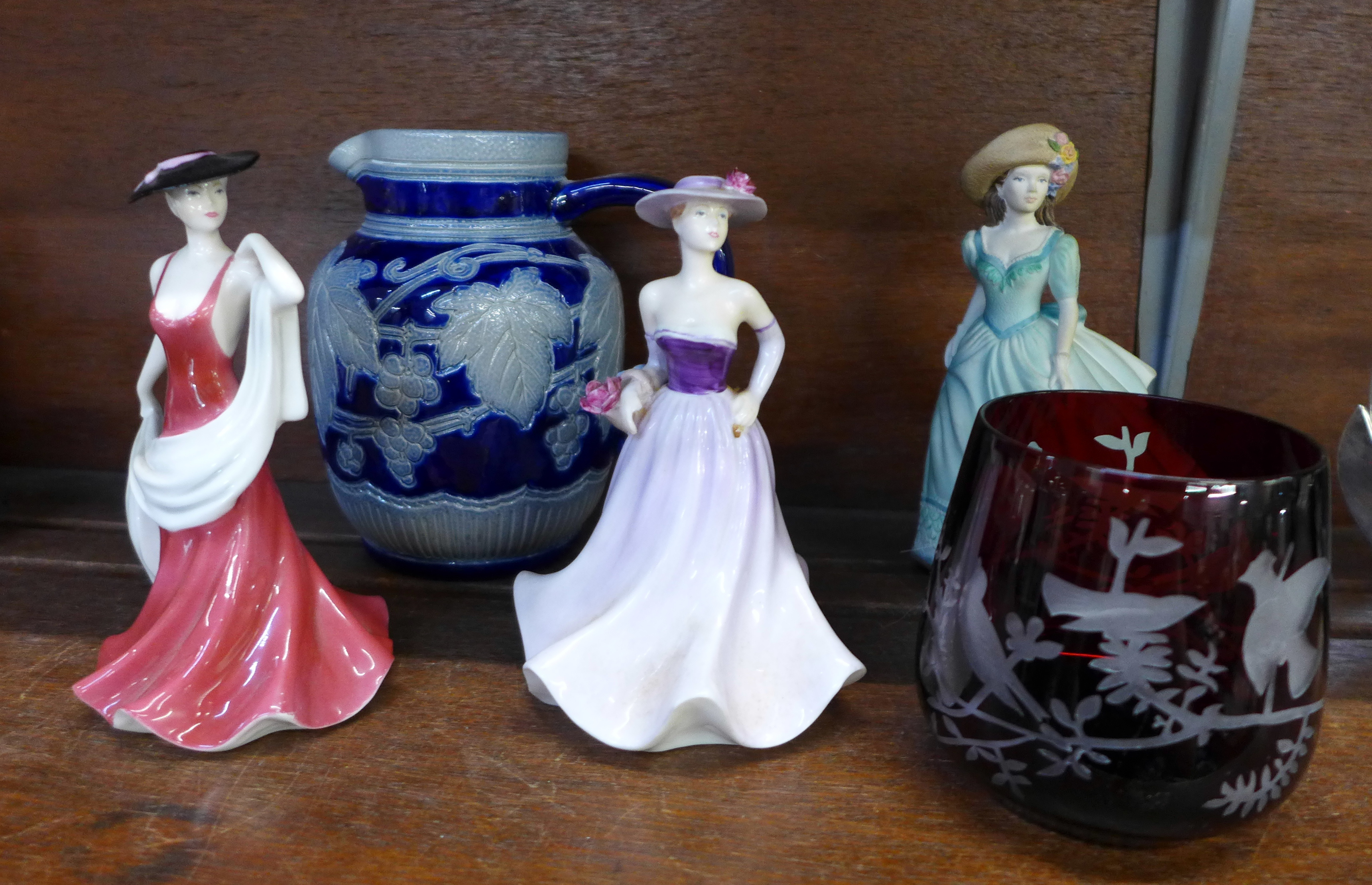 A blue and white jug, a ruby etched glass and three Coalport figures, two a/f