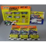 Three Matchbox Formula One cars in blister packs, a rare Nigel Mansell Collection two car set and