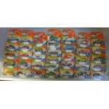 Sixty-six Matchbox Hero-City model vehicles in blister packs