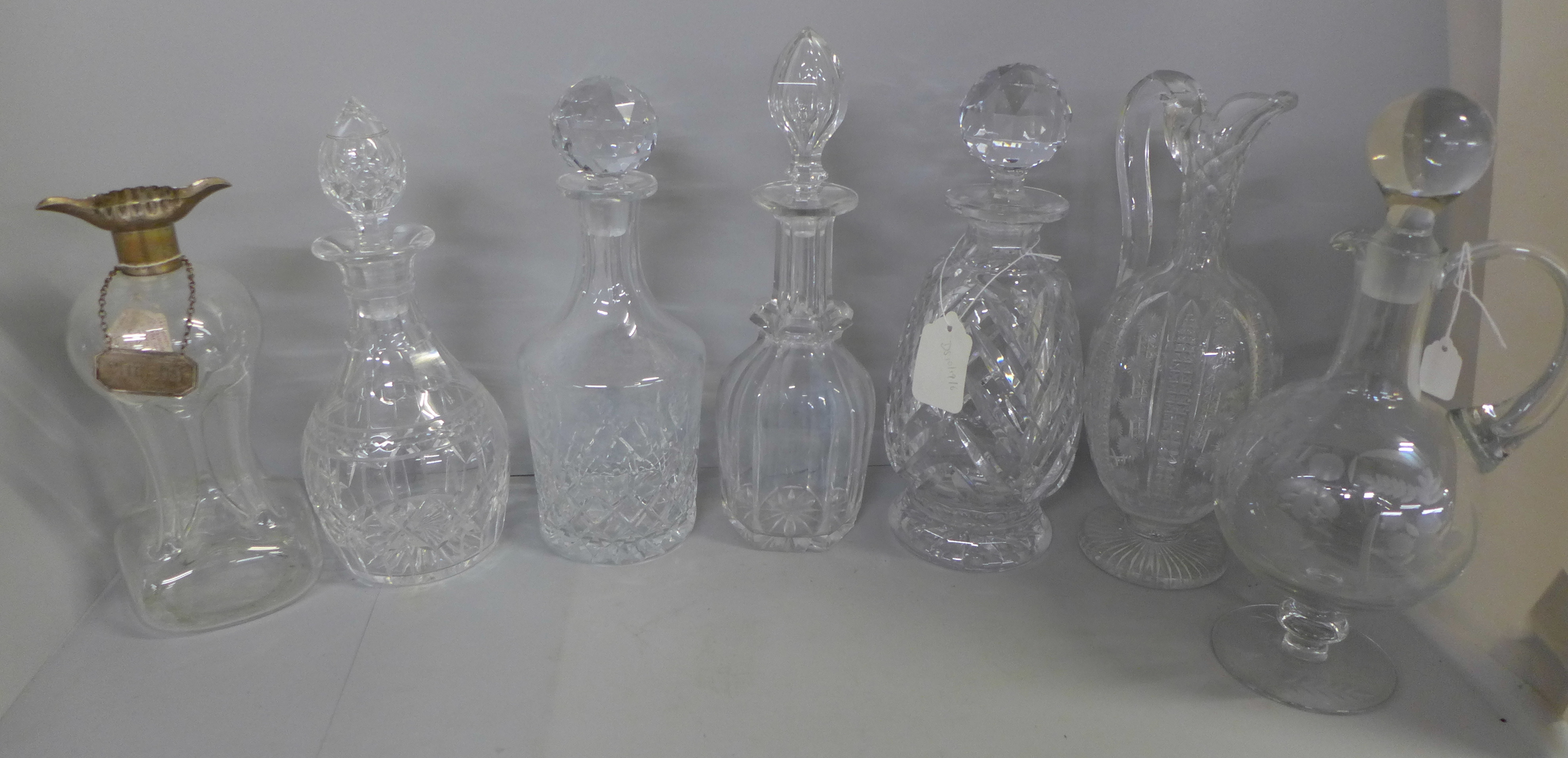 Seven 19th Century and later crystal and glass decanters, three lacking stoppers