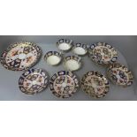 Four Imari trios and a sandwich plate, one saucer a/f