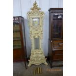 An Italian cream and parcel gilt quartz longcase clock