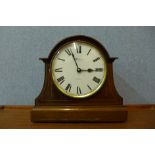 An inlaid walnut quartz mantel clock