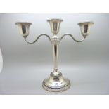 A silver single candlestick or three branch candelabra, by Adie Brothers, 21cm