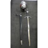 A reproduction Crusader helmet and a sword for re-enactments