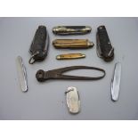 A military issue pocket knife, marked 1943 with broad arrow, other penknives and a shot mould