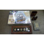 A servant's bell, binoculars, a bird watching book and a Revell HMS Victory Battle of Trafalgar set