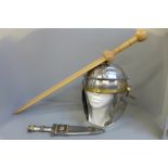 Battle re-enactment: A Roman style helmet, a dagger and a wooden gladius sword