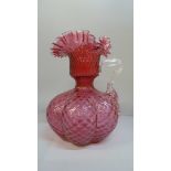 A large cranberry glass jug, 25cm