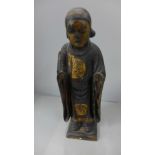 A 19th Century carved wooden polychrome figure of a young monk, paper label to base, Shotakia,