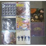 Eight Beatles LP records