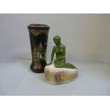 A Carlsberg advertising figure and a Blairs vase