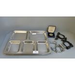 Two pairs of handcuffs, eight prison trays and a Police medal