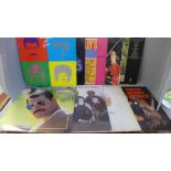 Fourteen LP records including Queen and Paul McCartney, seventeen Paul McCartney 7" singles and