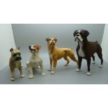 A Royal Doulton Boxer dog and three other dog figures